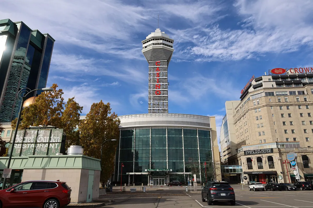 Casino Niagara on Falls Avenue in Niagara Falls, with its glass entrance and the tall tower above it